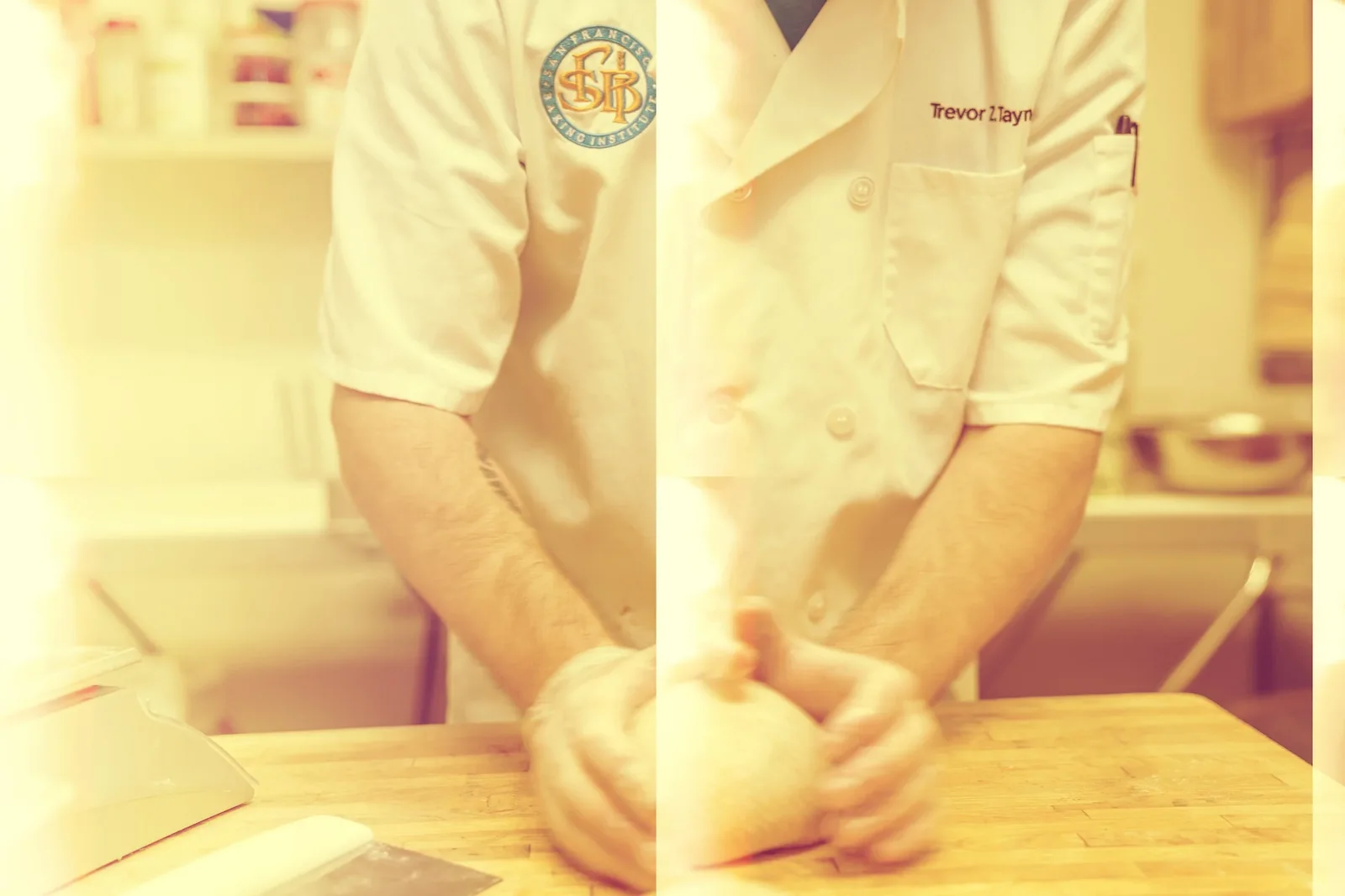 Trevor Taynor in his baker's coat at the counter